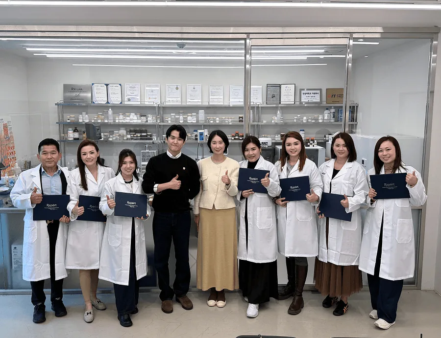 RXPERT professionals holding training certificates